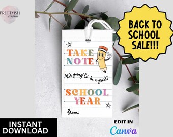 May include: A white tag with the text "TAKE NOTE" and "SCHOOL YEAR" in colorful letters, along with a cartoon pencil character. The tag also includes the phrases "It's going to be a great" and "from:". A yellow starburst graphic reads "BACK TO SCHOOL SALE!!!".