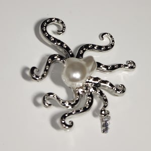 Spilla e anello in argento a forma di polpo