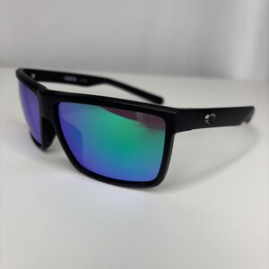 May include: Black sunglasses with a rectangular frame and mirrored lenses that reflect shades of blue and green. The sunglasses have a sleek, modern design, suitable for outdoor activities.