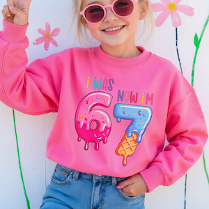 Kids’ 7th birthday sweatshirt inspired by the Six Seven meme. A comfy crewneck that makes a memorable birthday gift for boys and girls.