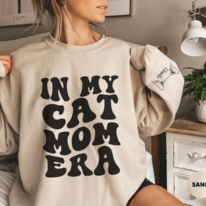 Custom Cat Ear Sweatshirt, In My Cat Mom Era Sweatshirt, Personalized Cat Name on Sleeve,New Cat Owner,Christmas Cat Lover Gift for Cat Mama