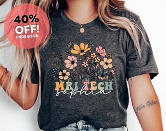 May include: Heather dark grey t-shirt with a floral design and the text "MRI TECH Sophia".