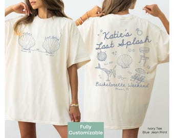 May include: Ivory t-shirt with blue jean print featuring a seashell design and the text "Katie's Last Splash Bachelorette Weekend Miami, FL".