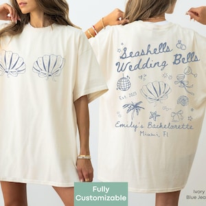 T-shirt personnalisé pour enterrement de vie de jeune fille sur le thème des coquillages et des cloches de mariage, idéal pour une fête sur la plage ou un enterrement de vie de jeune fille en bord de mer. Tenue spéciale coquillages pour une fête de jeunes filles.