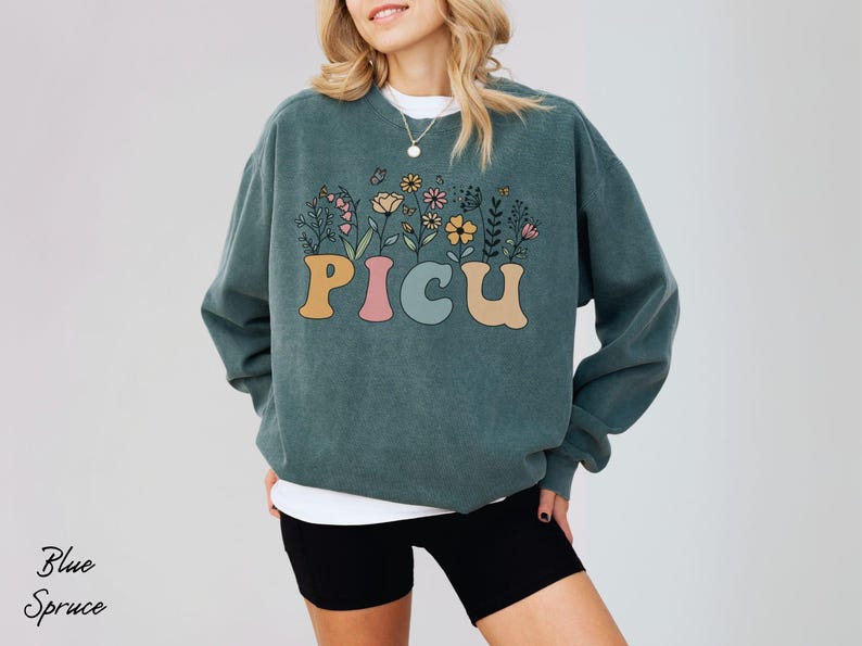 PICU nurse sweatshirt with a wildflower design, perfect for nursing graduates or holiday gifts for pediatric care professionals.