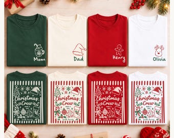 May include: Eight folded t-shirts in dark green, cream, red, and white. The top row features small holiday icons and names like Mom, Dad, Henry, and Olivia. The bottom row displays a large Christmas Crew graphic with festive motifs and text.