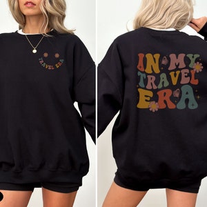 Cozy sweatshirt featuring the In My Travel Era design. Perfect for vacationers who want to show off their love for travel and adventure.