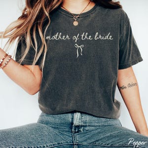 Oversized bridal party shirts with relaxed fit and bow design. Made for comfort during bridal showers bachelorette trips and getting ready moments.