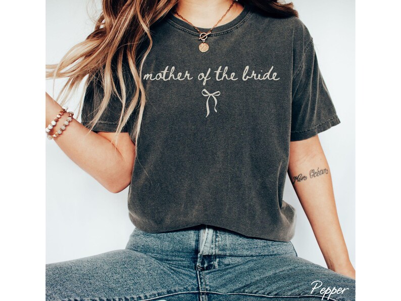 Oversized bridal party shirts with relaxed fit and bow design. Made for comfort during bridal showers bachelorette trips and getting ready moments.