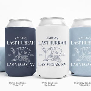 Three personalized beer can coolers with the text "NATHAN'S LAST HURRRAH" printed on them.