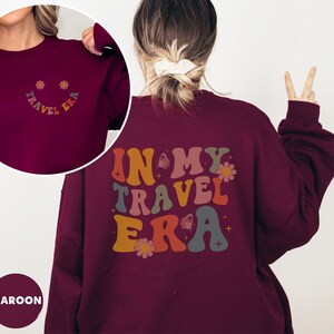 Relax in this In My Travel Era sweatshirt, ideal for casual outings or preparing for your next vacation. Show off your travel spirit with a fun and cozy design.