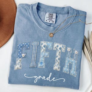 May include: A rustic wooden sign with the text "Welcome to our home" in white lettering. The sign features a distressed finish and a simple, inviting design, perfect for front door decor.
