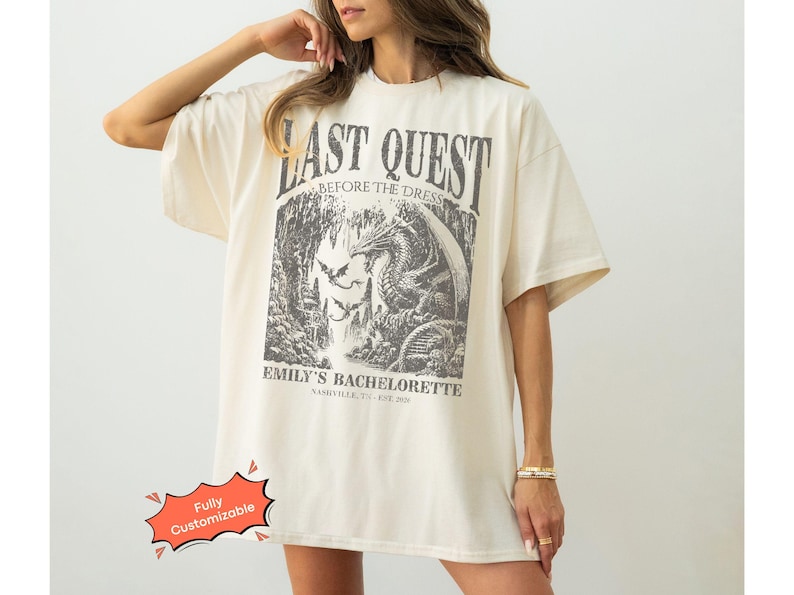 Comfort Colors® medieval bachelorette shirt with Last Quest fantasy dragon design and personalized text. A magical tee for bookish brides, Renaissance Faire bach trips, and castlecore bachelorette weekends.