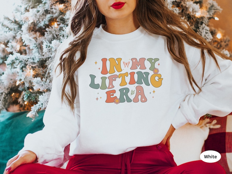 Wear your strength with pride with this In My Lifting Era sweatshirt. Ideal for anyone who is dedicated to their fitness journey and loves motivational gear.