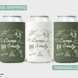 May include: Three green and white personalized can coolers with a camping theme. The coolers feature a white outline of a tent, campfire, canoe, compass, and stars. The text "Camp Emily" is printed on each cooler.