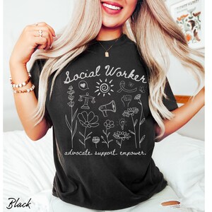 Licensed social work t-shirt featuring a soft floral graphic and positive text, crafted for LSWs, LMSWs, LCSWs, and MSWs celebrating their role in advocating for others.