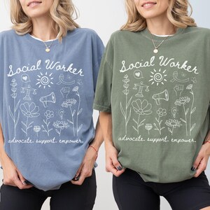 Inclusion-themed Comfort Colors® shirt with gentle flower illustrations and motivational script, designed for counselors, therapists, and social workers supporting mental health.
