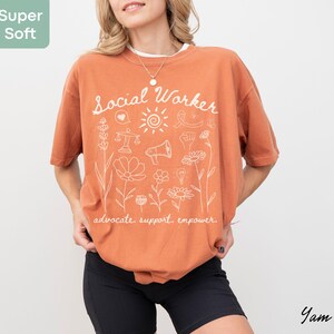 Gift-ready tee featuring “Advocate. Support. Empower.” script, ideal for social worker appreciation gifts, graduation presents, or team shirts.