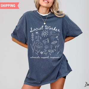 Soft, oversized tee with a supportive social work message, perfect for graduation gifts, back-to-school outfits, or everyday wear for licensed social workers.