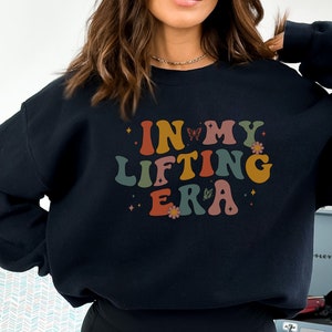 A fun and motivating gift for gym lovers and fitness enthusiasts. This In My Lifting Era sweatshirt makes an empowering statement for anyone into fitness and strength training.