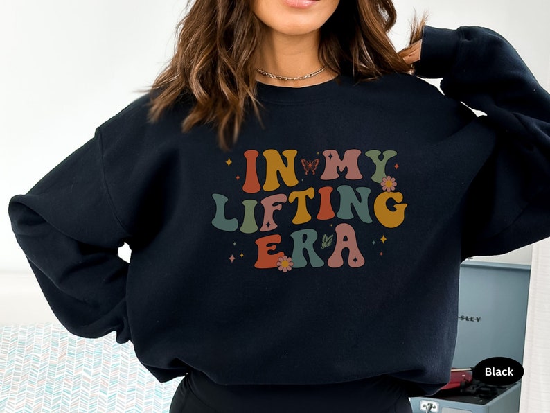 A fun and motivating gift for gym lovers and fitness enthusiasts. This In My Lifting Era sweatshirt makes an empowering statement for anyone into fitness and strength training.