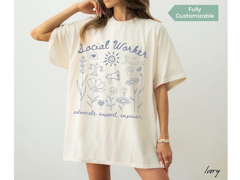Comfort Colors® shirt featuring “Advocate. Support. Empower.” script with floral accents, designed for school social workers, LCSWs, LMSWs, and MSWs who support students and families.