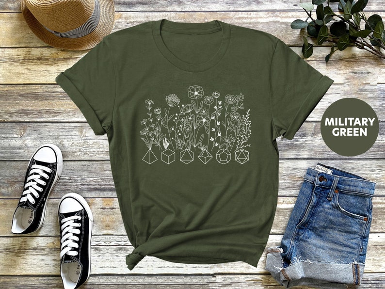 Floral Dungeons and Dragons shirt with a geometric dice graphic, perfect for a DnD birthday gift or as a gift for a DM.