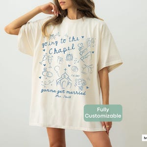 A soft and stylish Comfort Colors tee for the newly engaged, featuring a Going to the Chapel design—perfect for bridal showers or pre-wedding gifts.