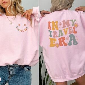 Thoughtful gift for any traveler. This In My Travel Era sweatshirt is ideal for those who love road trips, flying, or simply exploring the world.