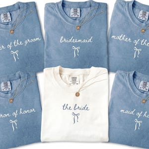 Coordinated bridal party tees displayed together for a clean cohesive look. Perfect for group bachelorette outfits and wedding morning memories.
