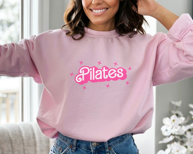 Pilates Coach shirt a great gift for Pilates coaches, offering a comfortable and stylish way to represent their role while staying active and fashionable