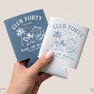 A hand holding two Club Forty birthday party coolers, one blue and one white, against a light background.
