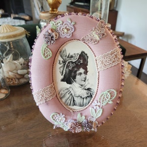 Pink padded ornate frame