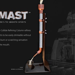 May include: The Mast, a copper and silver refining column, refines spirits to be easily drinkable without the burn or scratching sensation in the mouth. The text "HERE'S TO SMOOTH SPIRITS" is displayed below the logo. The column is pouring liquid into a silver cup. The background is a blurred image of a large yacht.