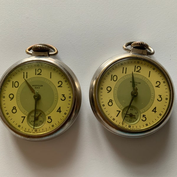 Pair of Westclox Dax pocket watches. For restoration. Pair of vintage/antique pocket watches. Not running.Possibly overwound. 41mm lens face