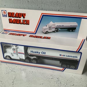 Husky Heavy Hauler rig. New in box. 18 wheeler semi-tractor toys. Husky Oil tanker. Mobil lubricants. Toy trucks. Scale model. Gas and oil.