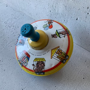 Ohio Art Spinning Top. Spiral driven top. Tin toy. Vintage dexterity toys. Fun! Tin litho. makers: etch-a-sketch. Tin top game. Vintage toys