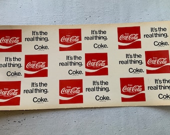 Coca-cola It’s The Real Thing. 1975. Coke. Cardboard 24” X 11” sign. Trade Mark Reg. Enjoy Coca-cola advertising . Cola wars. Vintage soda.