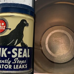May include: A vintage Whiz Quik-Seal can with a navy blue lid. The can features a black seal illustration and text that reads "Quik-Seal Instantly Stops Radiator Leaks". The can is cream-coloured with a red and white Whiz logo.