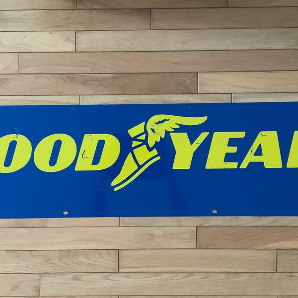 GoodYear 2 Sided metal sign. Winged Foot logo. Enamel paint. Tire rack topper. About 12” X 48”. Vintage Auto Service. Tires. Oil and gas.