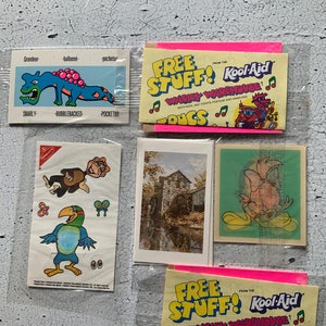 Vintage Cereal prizes. Kool-aid. Nabisco. Food prizes. Sweetie 1990 Warner bros. Keirstead art, old mill house. Mowhawkus Waspish Pocketus.