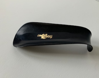 Vintage Shoehorn. The Bay. Promotional item. Black. Gold. Vintage plastics. Clothing accessory/assist. Footwear accessory item. Shoes.