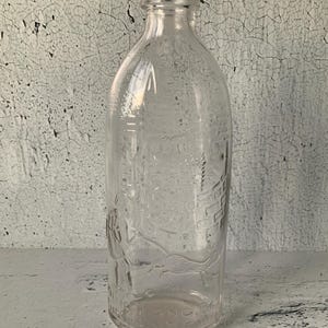 Ding Dong Bell Pussy&#39;s in The Well-babyfles. jaren 1920. Antieke vintage kinderliedjes. Dominion-glas. 6,5&quot;. Ovaal. Zeldzaam glas. Verzamelobject.