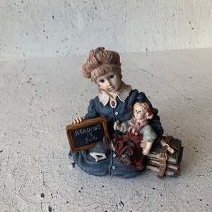 Yesterday’s Child. The Dollstone Collection. Michelle w/Daisy. #3511. Reading is fun. Porcelain decor. China. 1996.