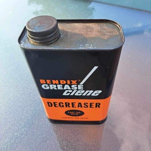 May include: A vintage can of Benddix Grease Clean Degreaser. The can is black with orange lettering and a white slash. The can is labelled "Part No. 40744" and "Contents One Quart".