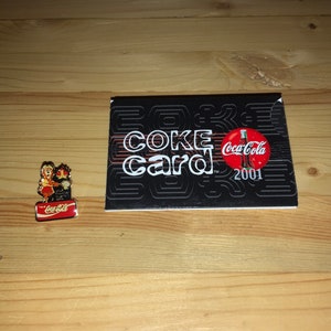 Coke pin and card. Collectibles. 1989, 2001.