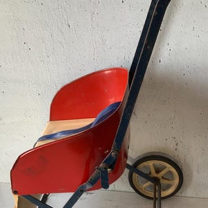 NLMP Doll Carriage. Metal. Enamel. Antique baby doll carriage. 1920’s.1930’s. New London Metal Processing Corp. Vintage doll collectibles.