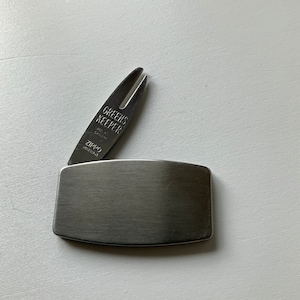 Zippo Greens Keeper. Quality!! Ad piece. SGI Canada. Golf. Cleat cleaner. Turf tool. Westland Agencies. Carlyle. On the links. Golf support.