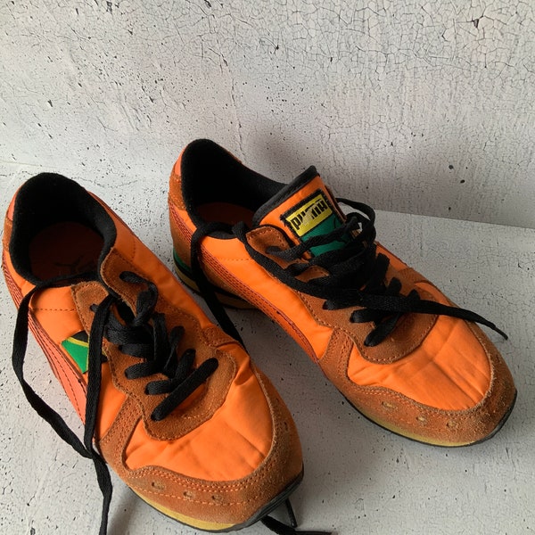 Puma Usain Bolt shoes. Vintage athletic wear. Bolt signed in 2003 at 17 yrs. Sports attire. Designer Running shoes. Ladies’ wear size 6.5US.