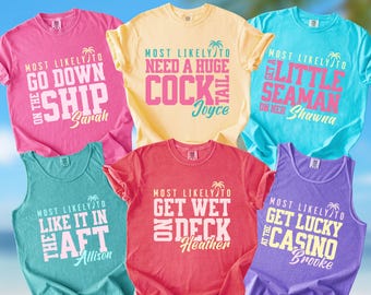 May include: A collection of colorful t-shirts and tank tops with humorous phrases printed on them. The shirts are in shades of pink, yellow, teal, red, and purple. The text includes phrases like "Most Likely To Go Down On The Ship" and "Most Likely To Get Wet On Deck."